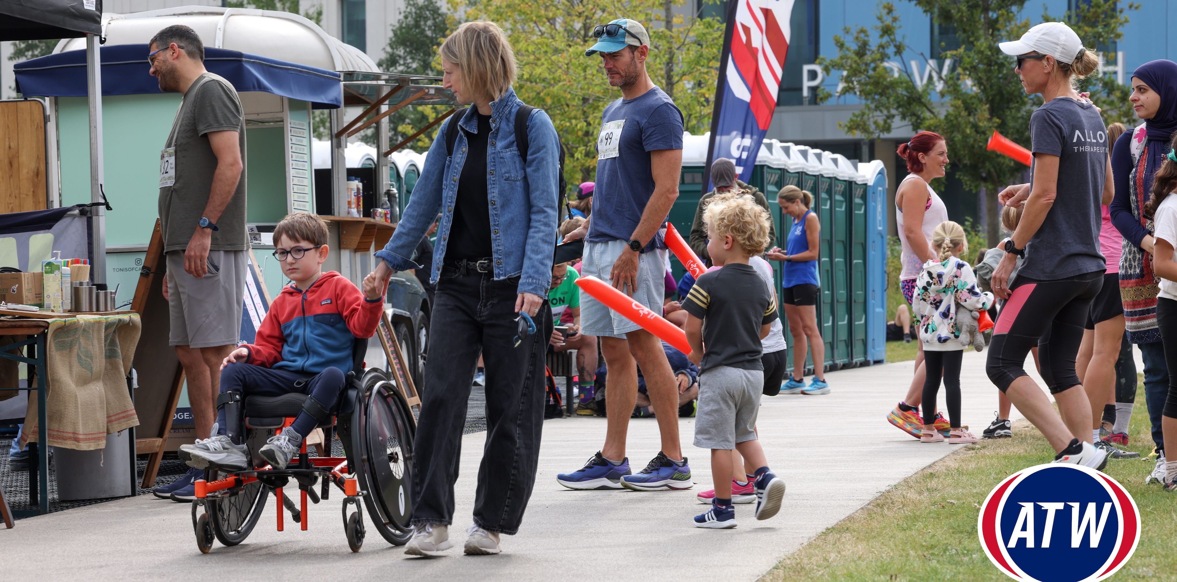 Boy in a wheelchair with parent