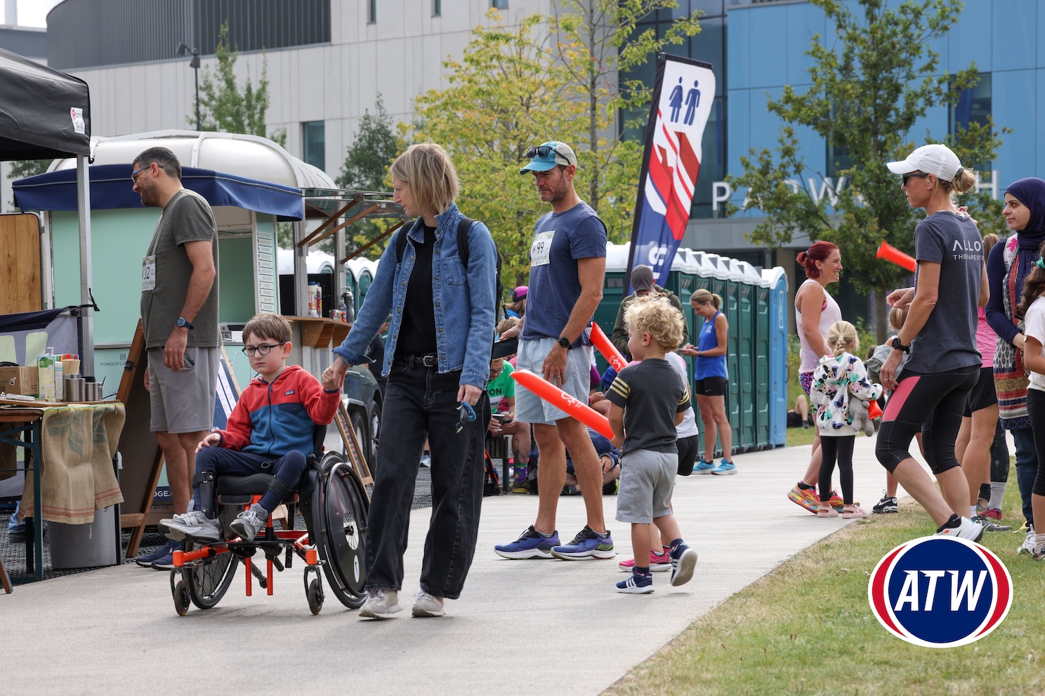 Boy in a wheelchair with parent