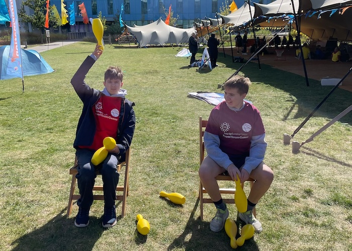 PowerHouseGames two boys throwing skittles over their heads