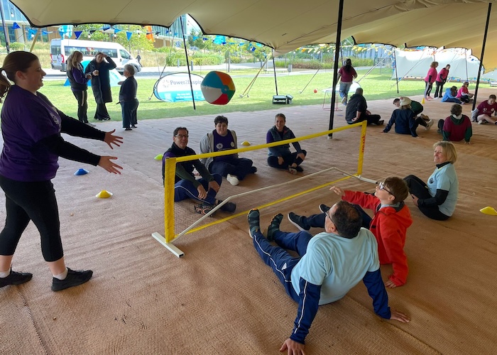 PowerHouseGames teams playing sitting volleyball